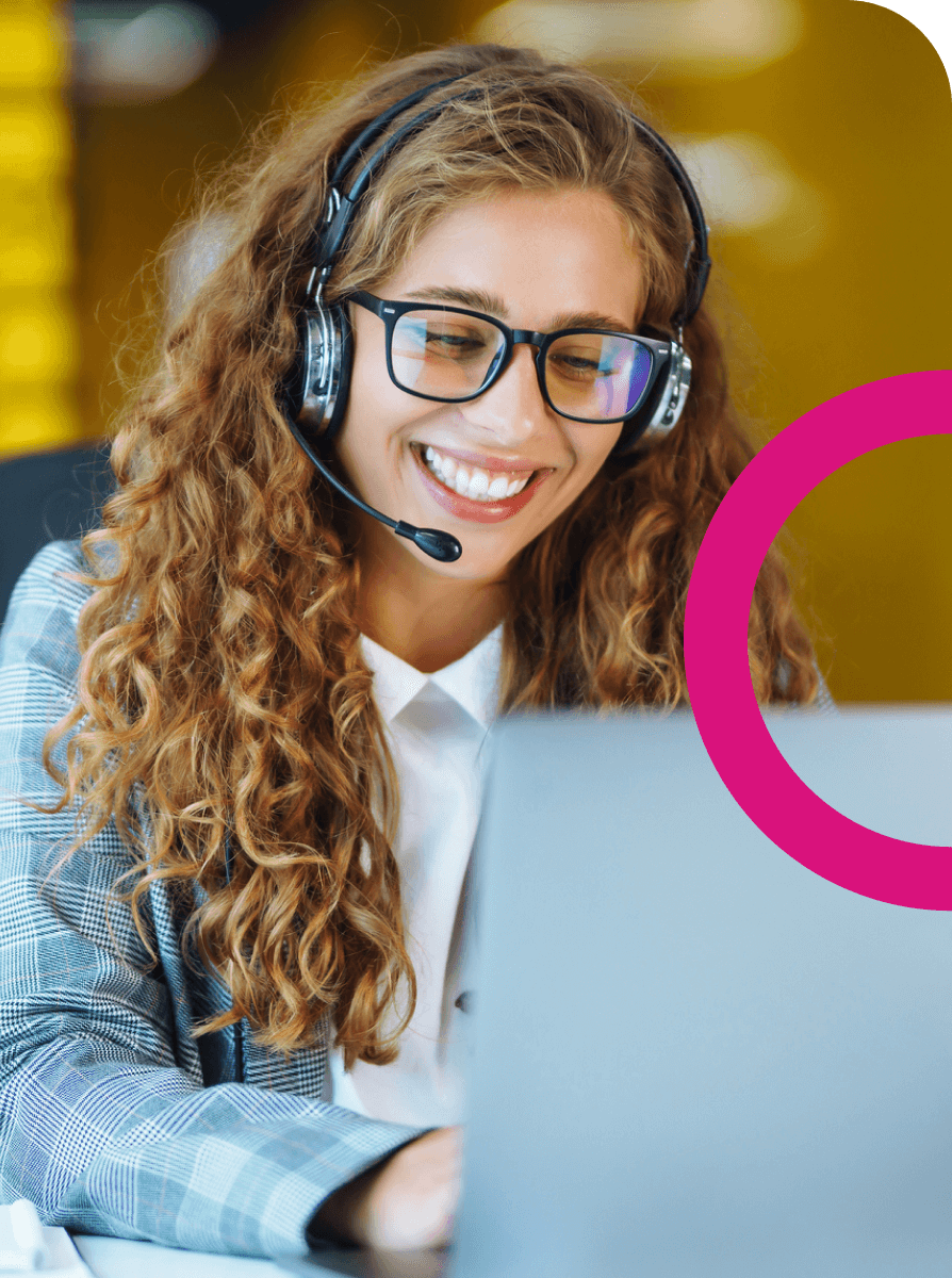 Woman on laptop with headset supporting customers